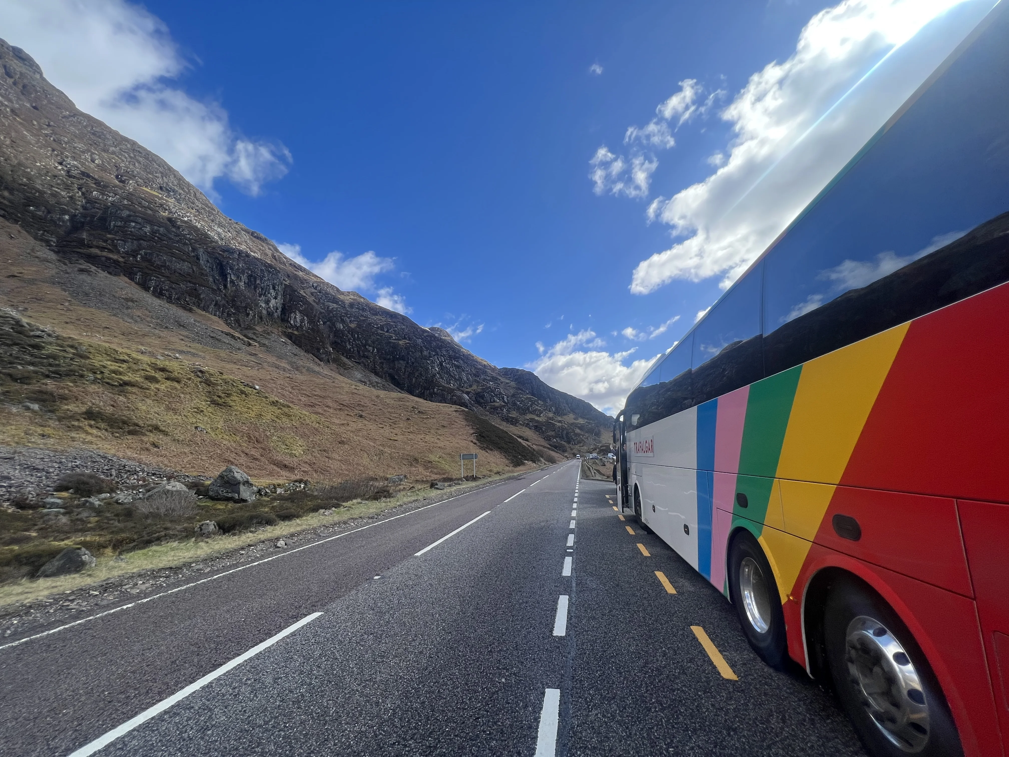 Coach travelling through Glencoe in Scotland